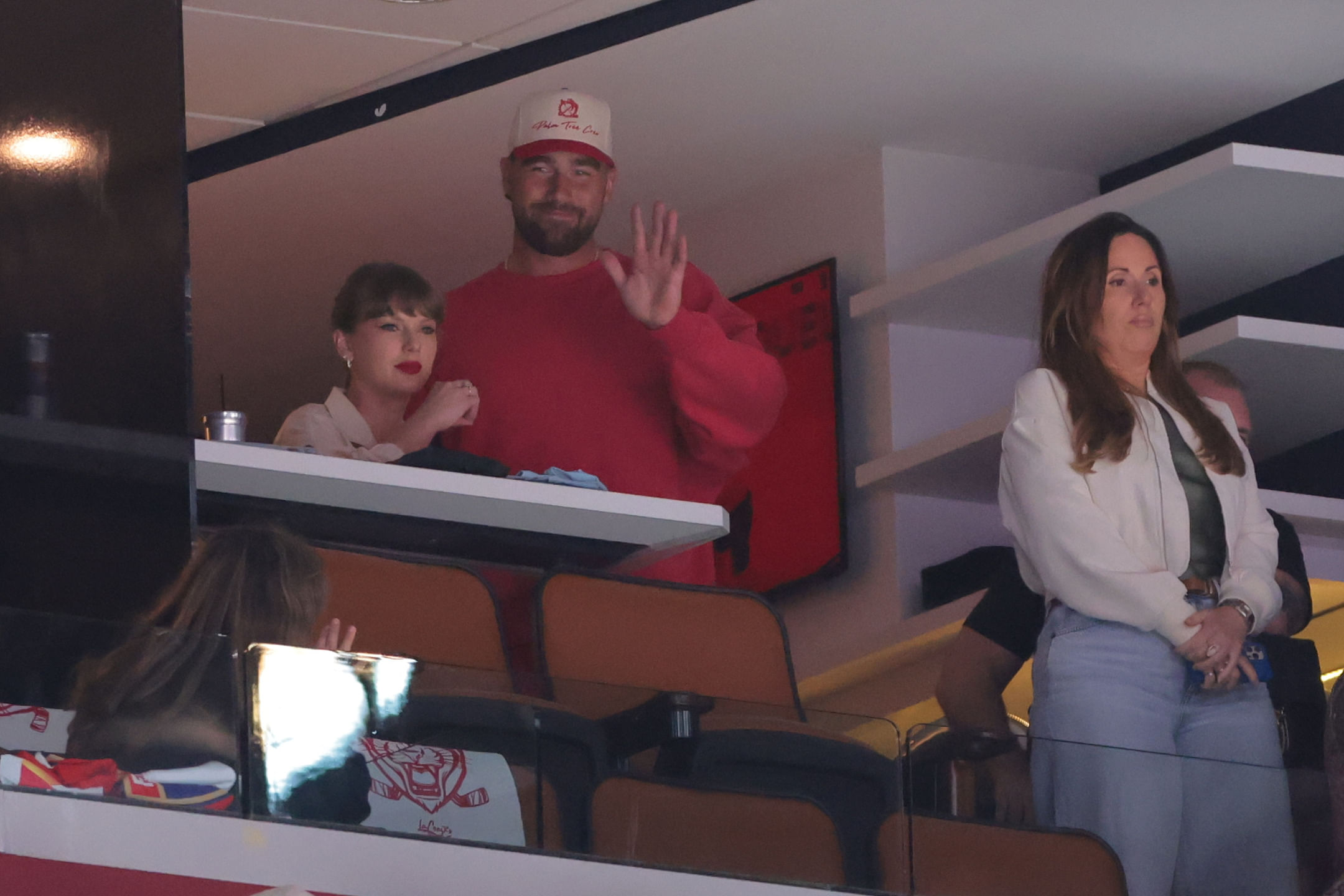 Taylor Swift and Travis Kelce saluted fans as cameras focused on the smiling couple during Game 4 of the Stanley Cup Final - Source: Imagn